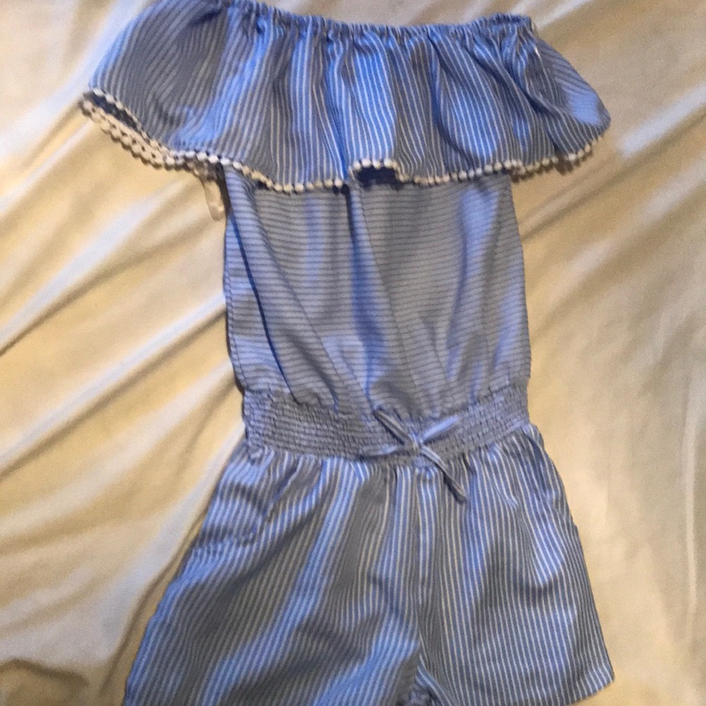 Light blue romper by the brand pony tails